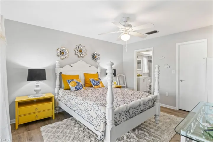 Spacious primary bedroom with walk-in closet and natural light.