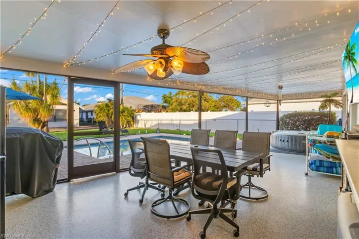 Lanai overlooking pool and yard, creating a seamless indoor-outdoor lifestyle.