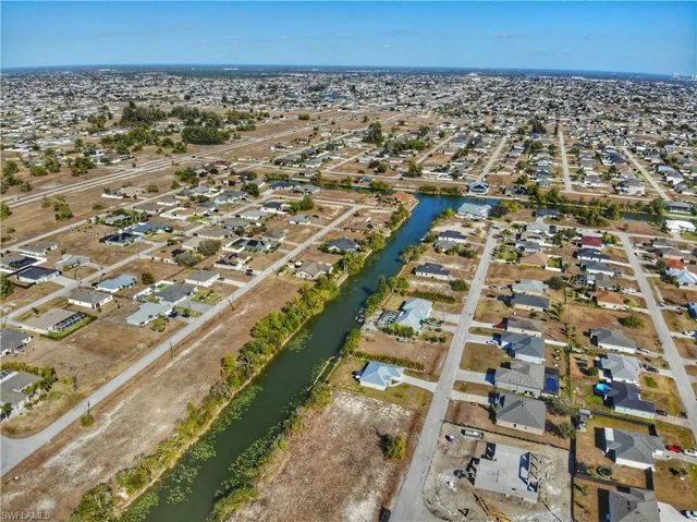View of property location with nearby suburban area and a large body of water