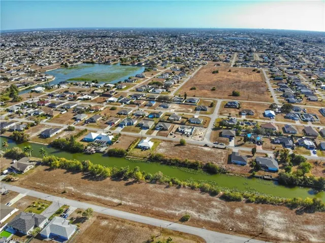 Aerial view of property's location featuring nearby suburban area