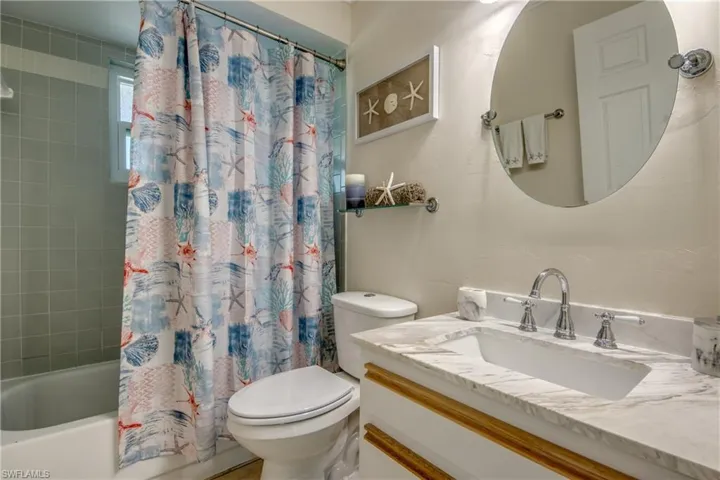 Full bathroom with shower/bath combination