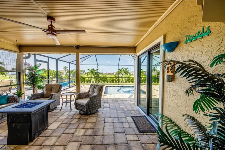 Large, covered lanai with fire pit, perfect for entertaining