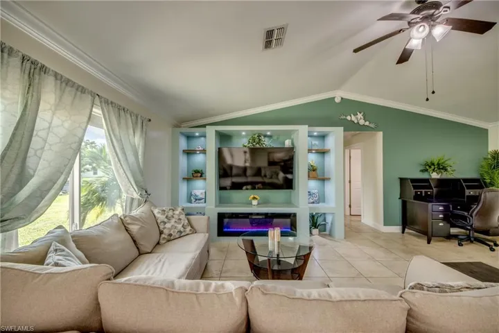 Built-ins with beautiful lighting features and electric fireplace
