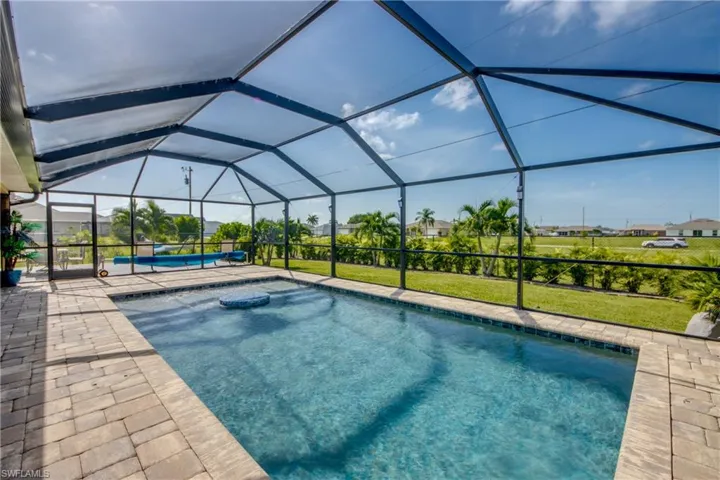 View of swimming pool & picturesque backyard