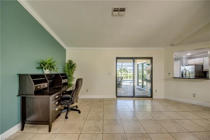 Large flex space with impact glass slider leading to lanai