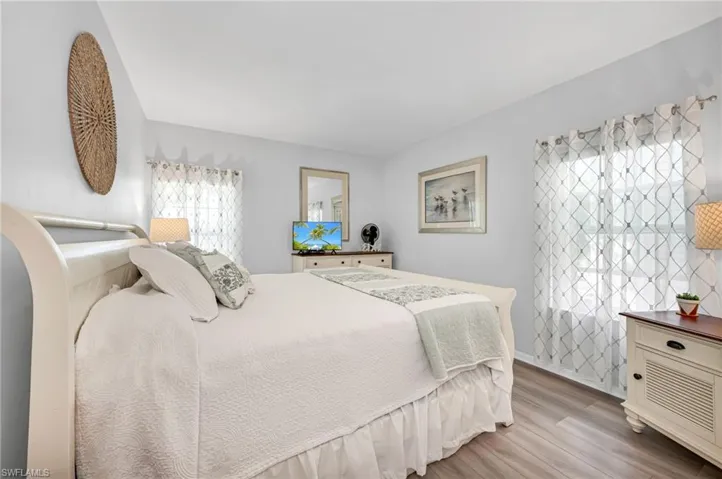 Spacious guest bedroom with natural light, perfect for family and visitors.