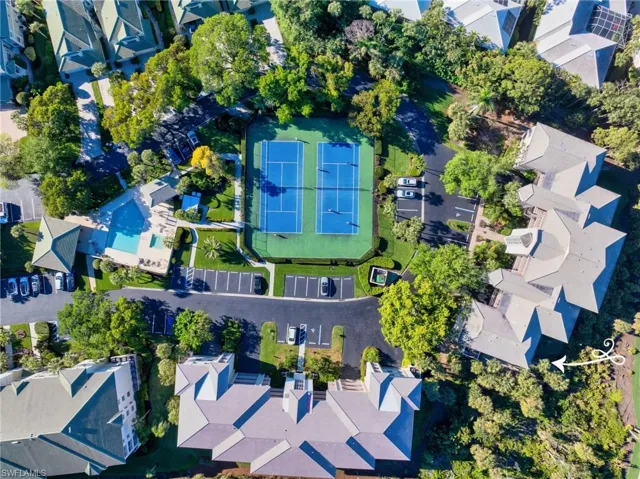 Aerial shot of Greenbriar’s private pool and clubhouse, a perfect spot to relax and unwind.