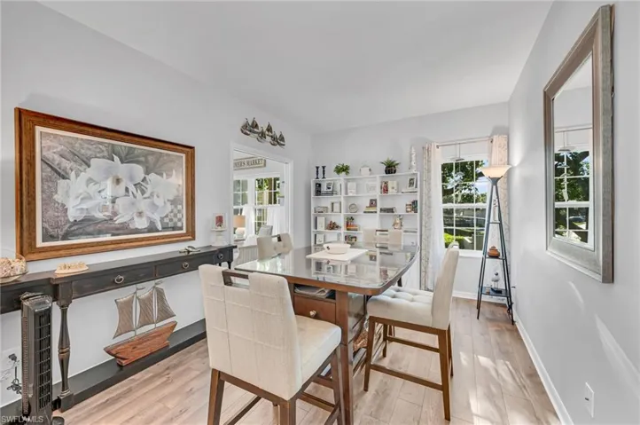 A charming breakfast nook surrounded by windows, perfect for enjoying your morning coffee.