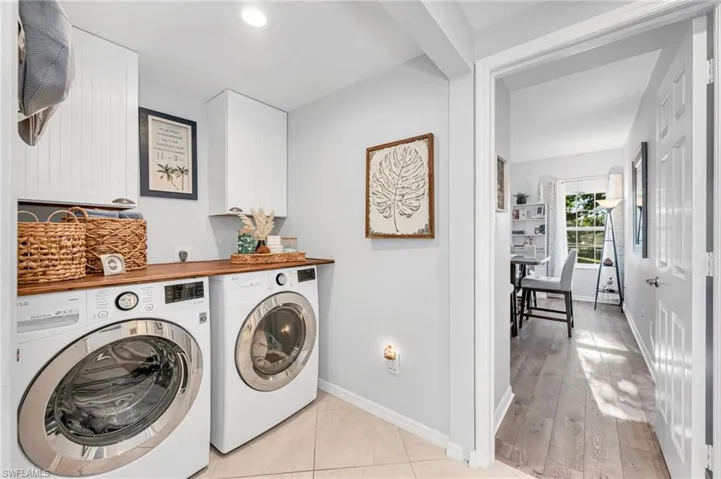 Convenient in-unit laundry with upgraded appliances and extra shelving.