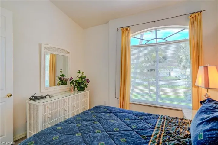 Bedroom with vaulted ceiling