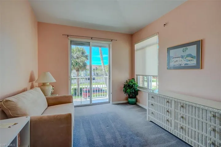 Living area with carpet and baseboards