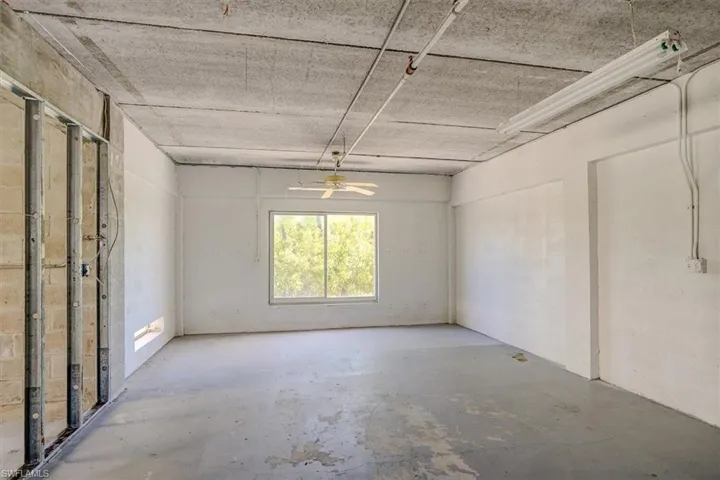 Spare room featuring concrete flooring