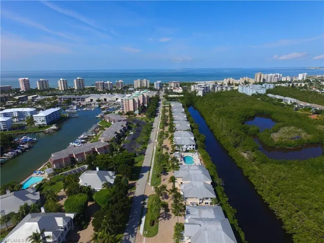 View of property location with a nearby body of water and nearby urban area