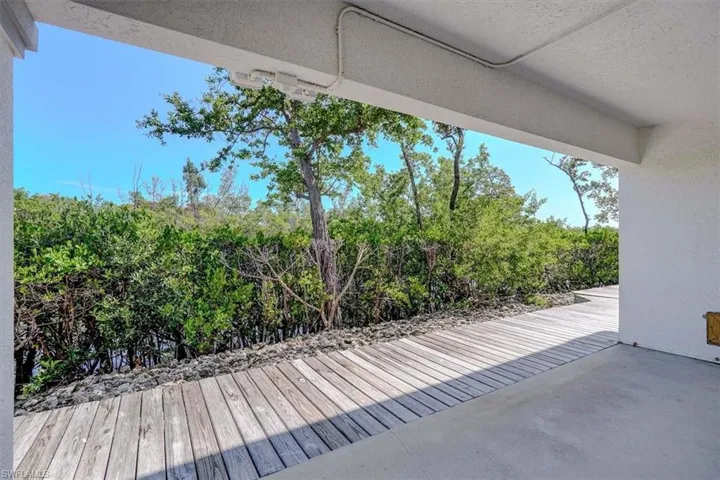 View of patio / terrace featuring view of wooded area