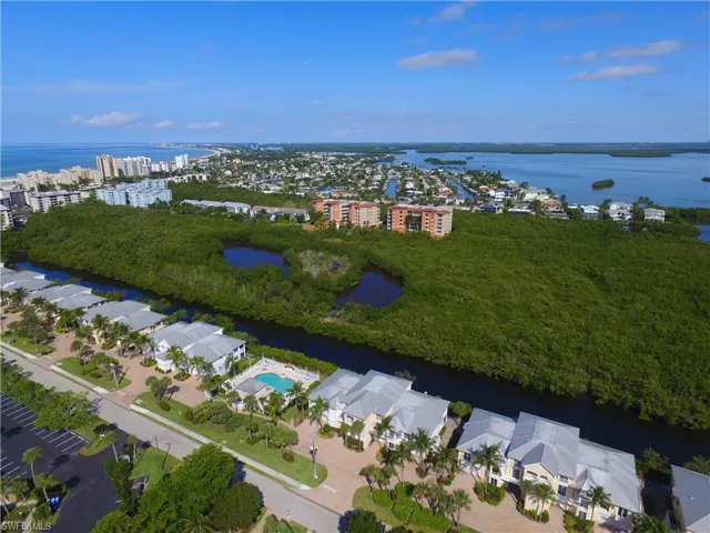 Aerial overview of property's location featuring a nearby body of water