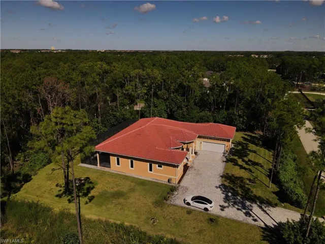 View from above of property with a forest