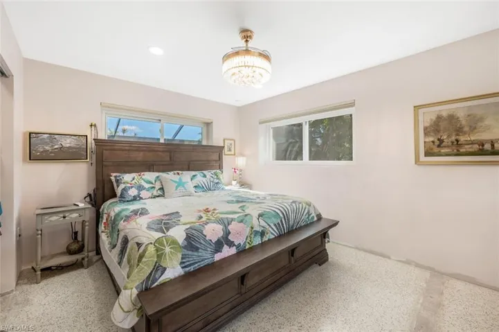 Bedroom featuring a chandelier