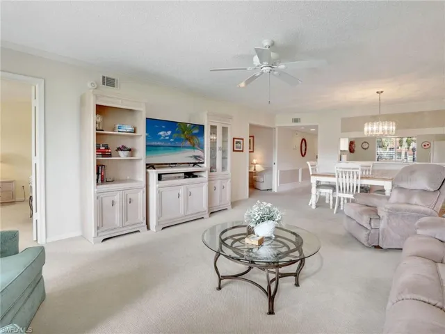 Living area with doorway to the primary suite