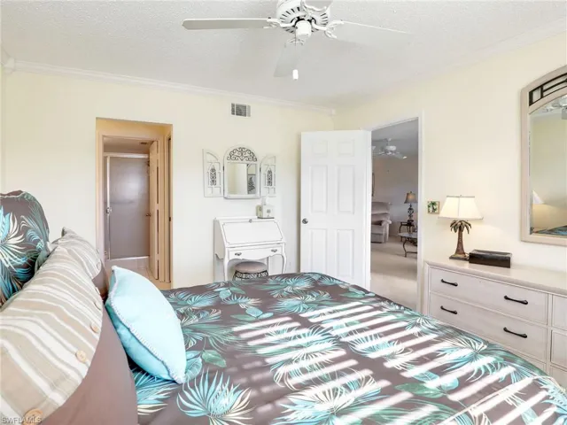 Primary bedroom with doorway to primary bathroom