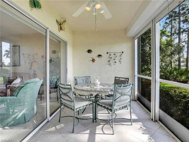 Nice sized lanai with large tile flooring and electric shutter