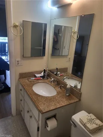 Ensuite bathroom featuring vanity and toilet
