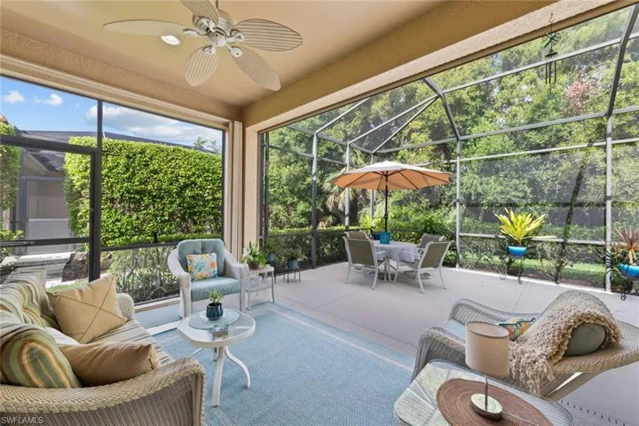 Sunroom featuring ceiling fan and a healthy amount of sunlight