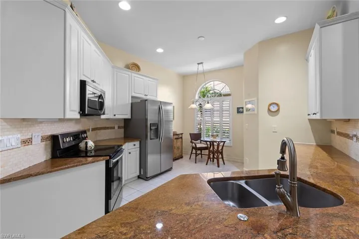 Kitchen boasts stainless steel appliances