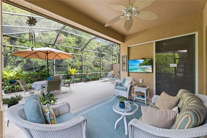 Sunroom featuring ceiling fan and TV