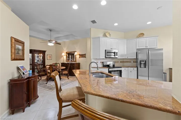 Kitchen features island for dining or serving