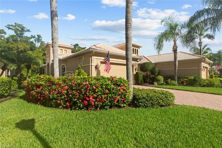 View of property exterior with a garage and a yard