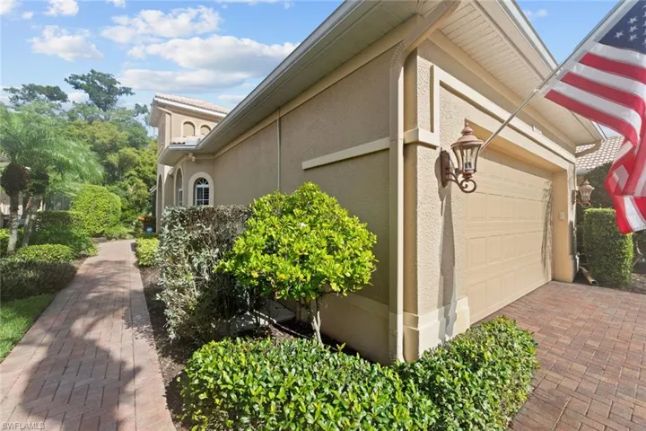 View of side of property with a garage