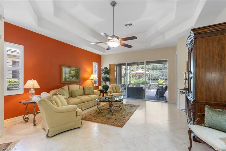 Tiled living room opens to kitchen