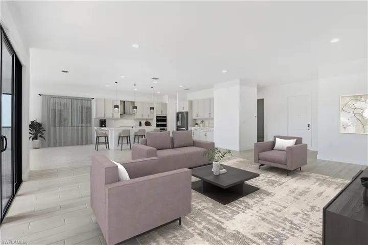 Virtually styled living room featuring light wood-style flooring and recessed lighting