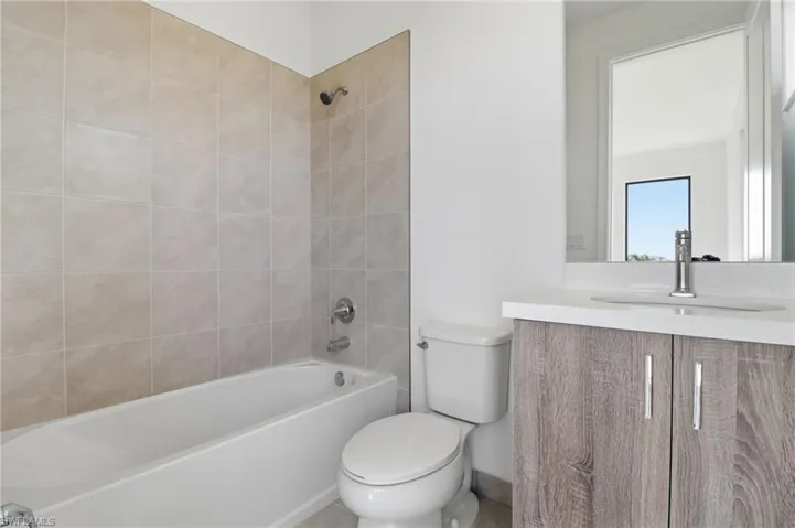 Full bathroom featuring vanity and shower / bathtub combination