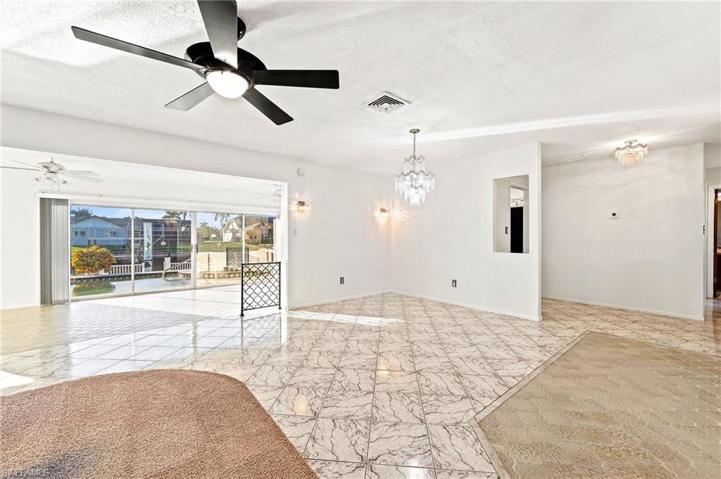 Living & Dining rooms open to Family room with wide view of thge water.