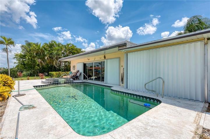 Beautiful pool with Spa. Accordion Hurricane Shutters throughout.