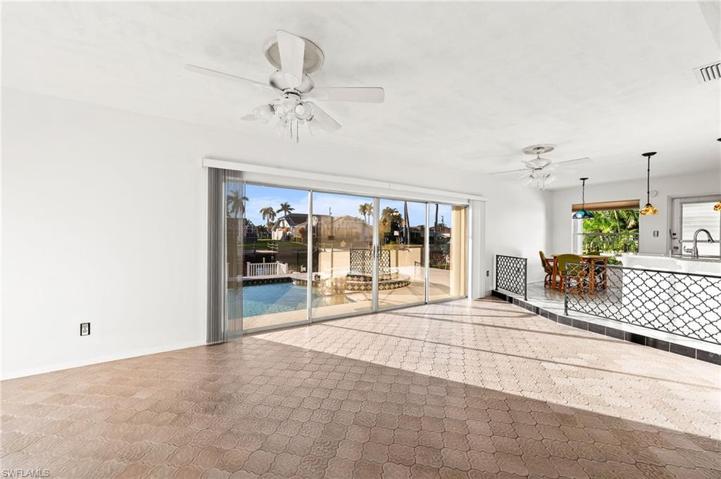 Family room with 4 wide sliders out to the lanai. Also has accordion hurricane shutters.