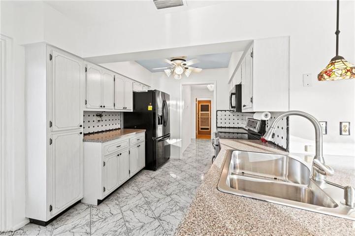 Lots of Cabinets. That's the garage door thru a Laundry / Pantry Rm.