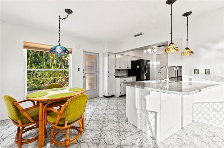 Family Room is connected to eat-in area & Kitchen. Bar-top eating area by the sink.