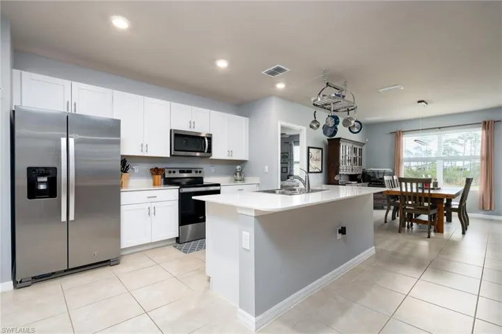 Lots of cabinets, even over the fridge, and large pantry closet