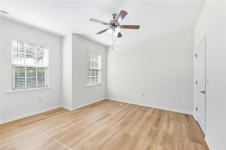 Unfurnished room with light wood-type flooring and ceiling fan
