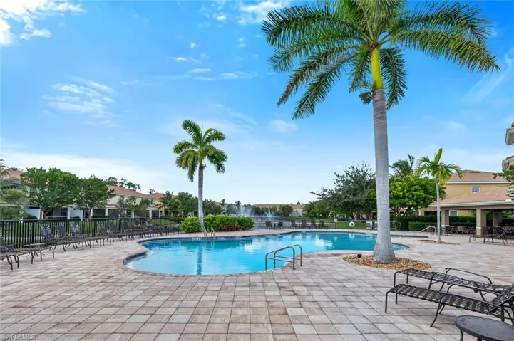 Community pool with a patio