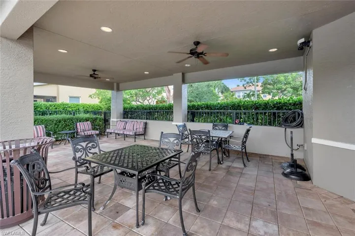 View of patio with ceiling fan and outdoor dining space