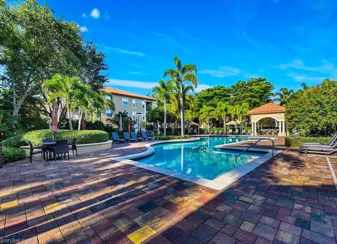 Community pool with a patio and a gazebo