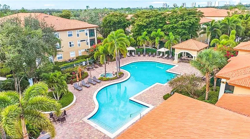 Community pool with a patio