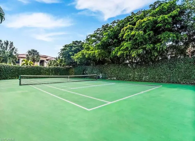View of tennis court with community basketball court