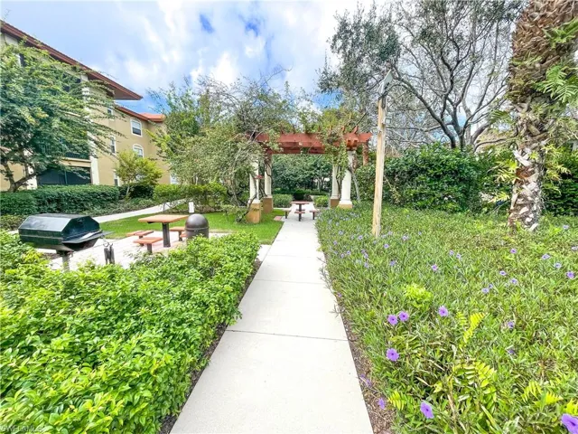 View of community featuring a pergola and a patio