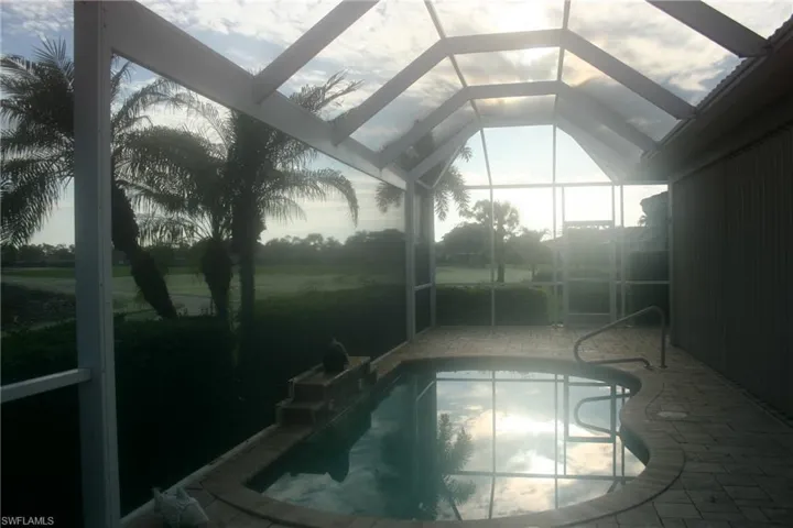 Outdoor pool with a sunroom