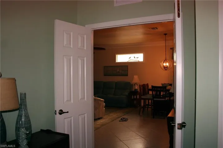 Hallway featuring tile patterned floors