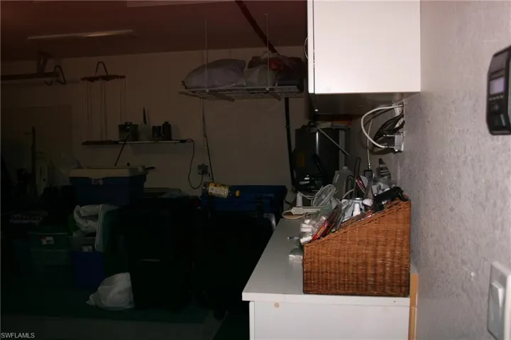 Garage featuring water heater